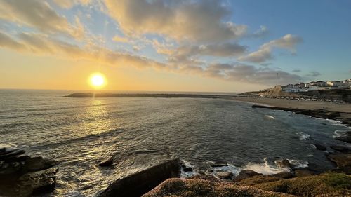 Scenic view of sea against sky during sunset