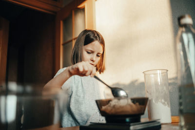 Cute girl cooking at home