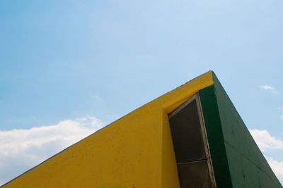 Low angle view of built structure against blue sky