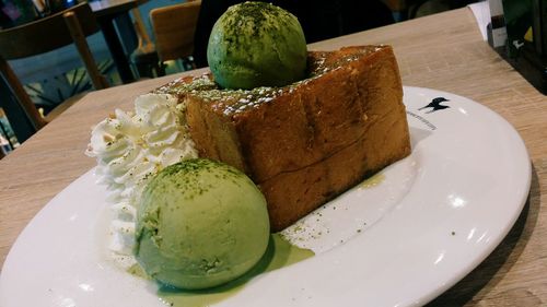 Close-up of served ice cream in plate on table