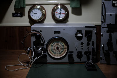 Close-up of old radio station on table at home