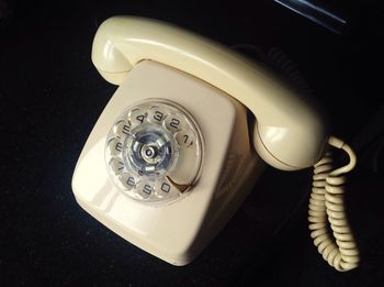 High angle view of telephone on table