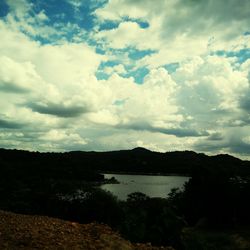 View of landscape against cloudy sky