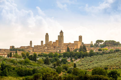 Buildings in city against sky