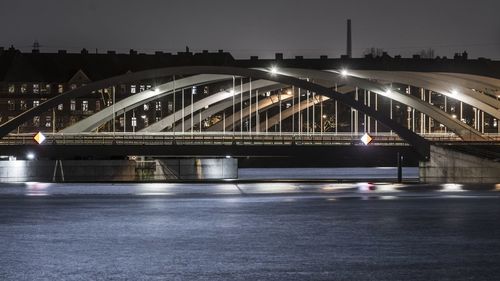 Illuminated bridge at port of hamburg at night