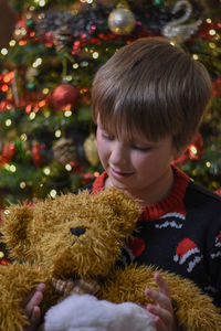 Cute boy with christmas tree