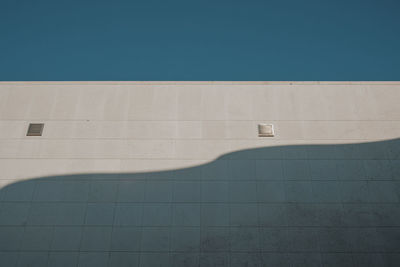 Low angle view of building against blue sky