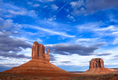 Rock formations on landscape against sky