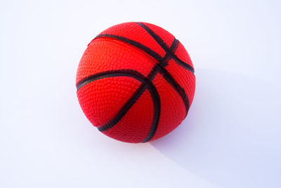 Close-up of red ball against white background