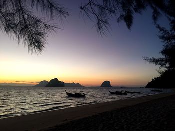 Scenic view of sea against clear sky at sunset