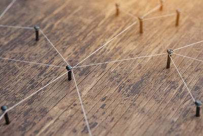 High angle view of umbrella on wooden table