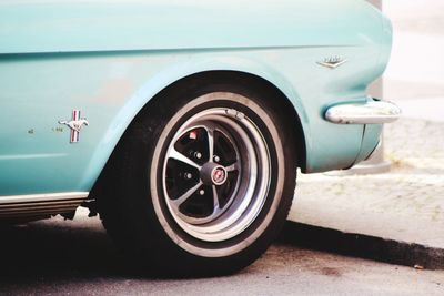 Close-up of vintage car on road