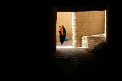 People walking in tunnel