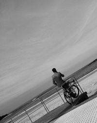 Man working against sky