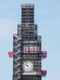 Low angle view of clock tower against sky