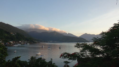 Scenic view of lake and mountains against sky