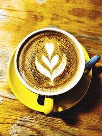 Close-up of cappuccino on table