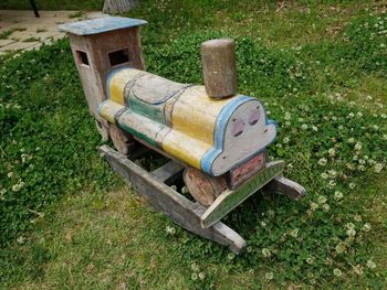 High angle view of old bench in field