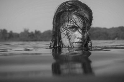 Portrait of woman in lake