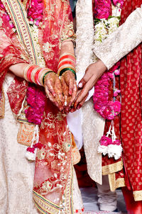 A hindu couple performing saat phere / seven vows of hindu marriage.