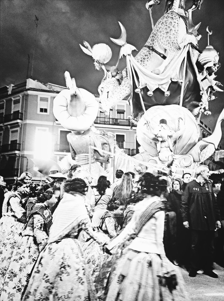 building exterior, architecture, lifestyles, men, built structure, street, person, leisure activity, night, large group of people, illuminated, outdoors, walking, celebration, high angle view, umbrella, city, sunlight