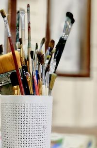 Close-up of paintbrushes on table