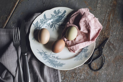 High angle view of eggs in plate on table