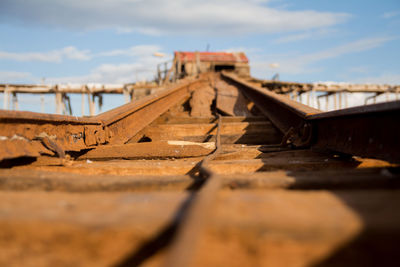 Close-up of damaged construction site against sky