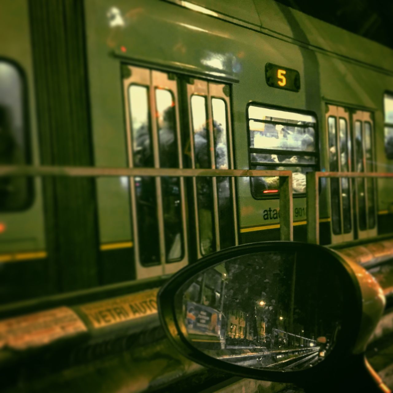 CLOSE-UP OF TRAIN IN ILLUMINATED BUS