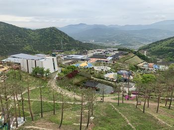 High angle view of buildings and mountains against sky