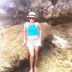 Portrait of young woman standing on beach