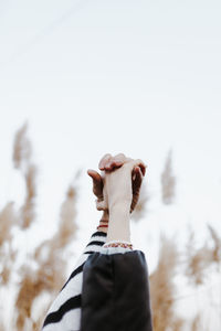 Close-up of a couple's linked hands. woman and man united