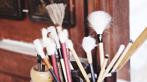 Close-up of paintbrushes on table