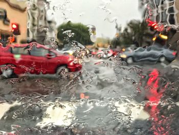 Close-up of water drops on car window during rainy season