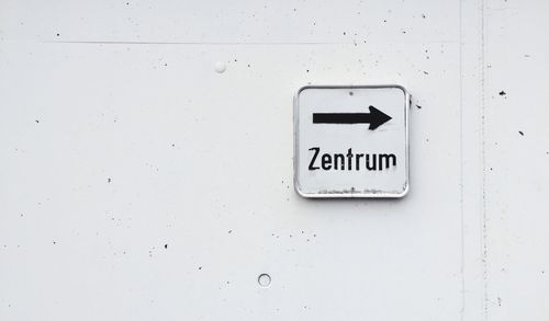 Directional sign on wall