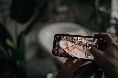 Luxury interior of big bathroom at modern african style with oval bathtub in natural lighting