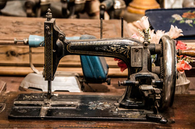 Close-up of vintage sewing machine on table