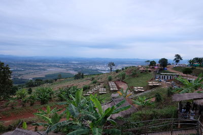 High angle view of buildings and sea against sky