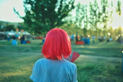 Rear view of a woman on field