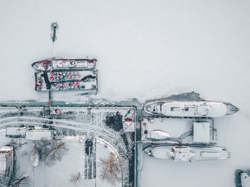 Aerial view of boats moored at frozen harbor