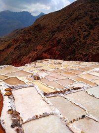 High angle view of landscape against mountain range. salineras de maras. salt ponds of maras