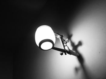 Low angle view of illuminated light bulb