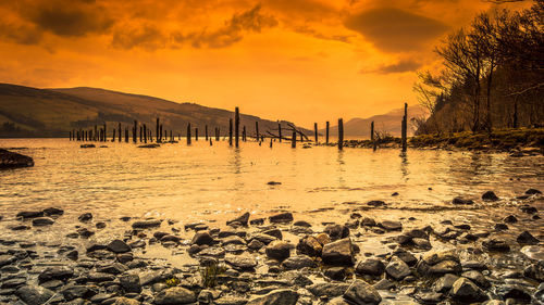 Scenic view of sea against sky during sunset