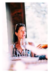 Portrait of smiling woman sitting at restaurant