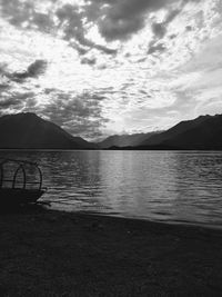 Scenic view of lake against sky during sunset