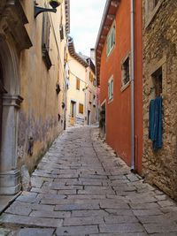 Narrow alley amidst buildings in town