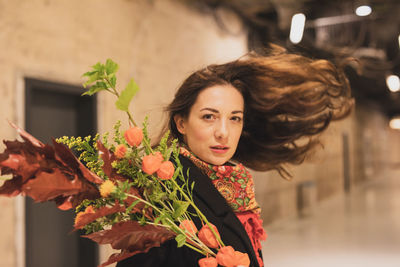 Portrait of woman holding bouquet 