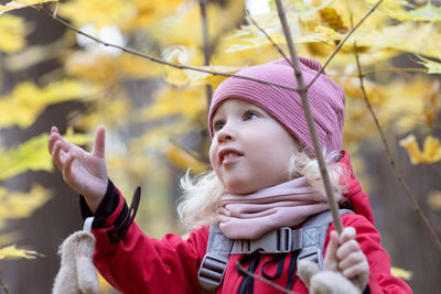 Portrait of girl looking away outdoors