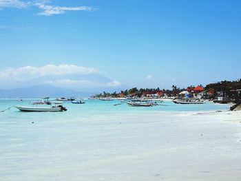 Boats moored on beach