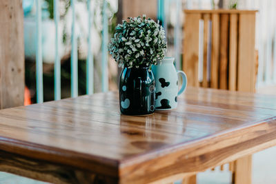 Close-up of flower pot on table at home